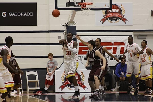 A high-school player making a pass