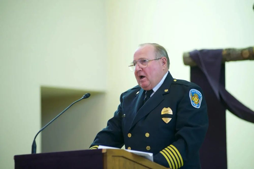 Chief Doc Moltrup speaking at a podium