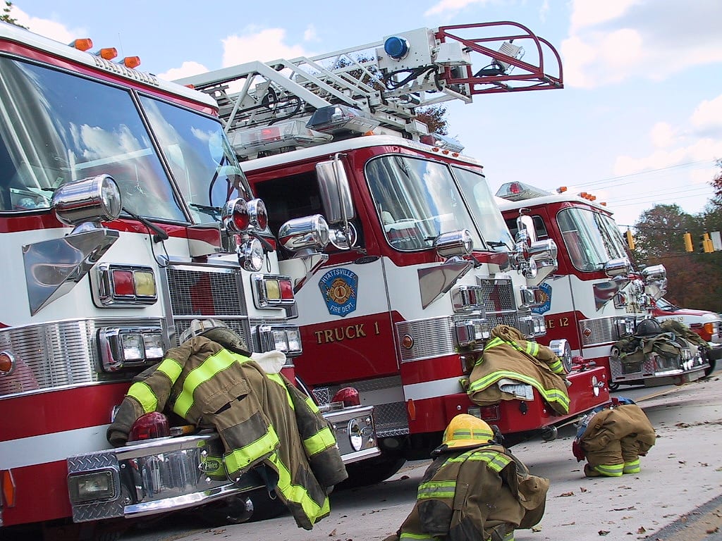 Hyattsville Truck 1 and Engine 12 with turnout gear staged on the bumpers