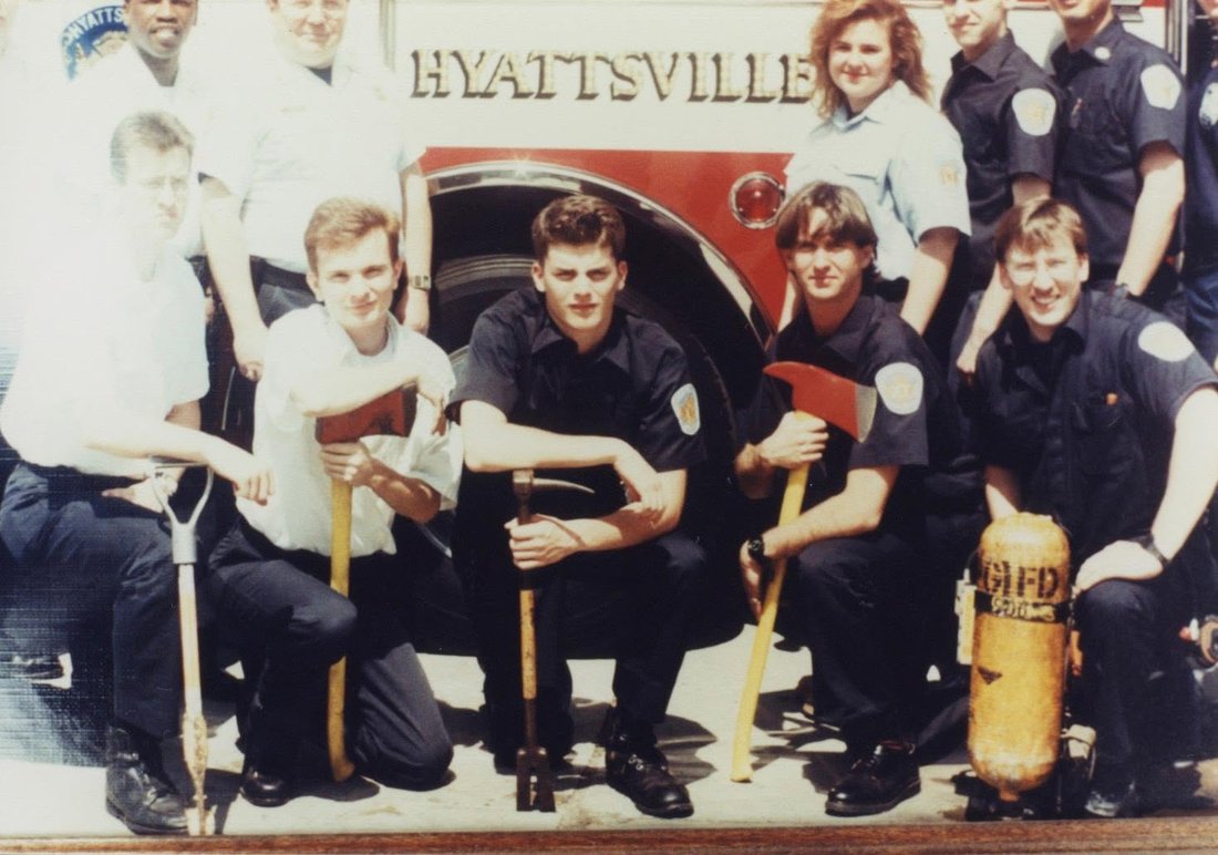 A young Hyattsville crew with tools in front of the engine