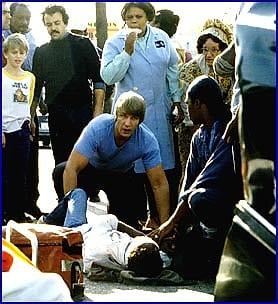 Firefighter Alan P. Sondej tending to a patient at an emergency scene