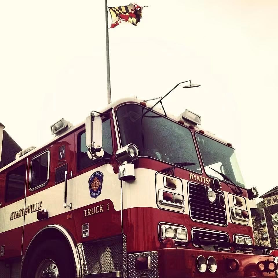 Hyattsville Truck 1 beneath the Maryland flag
