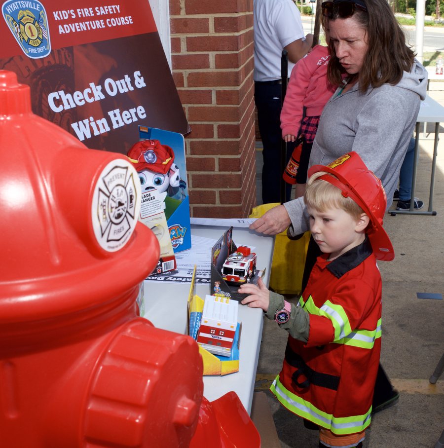 A child in firefighter gear at the Kids Fire Safety Adventure Course