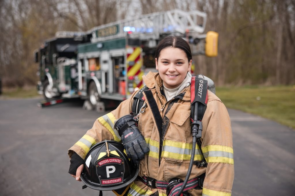 Two firefighters talking during a training break